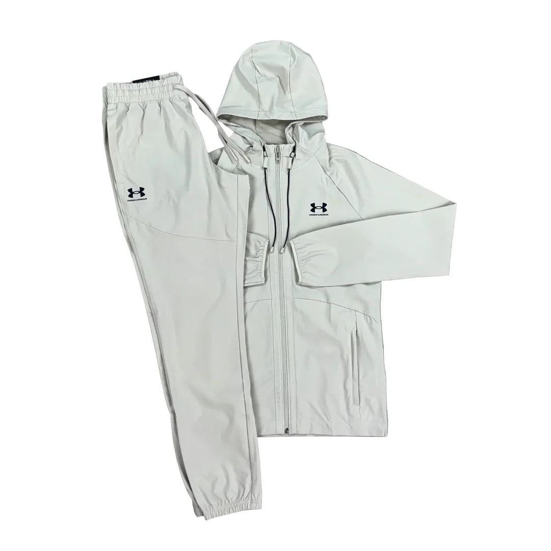 UNDER ARMOUR - WOVEN TRACKSUIT “STONE”